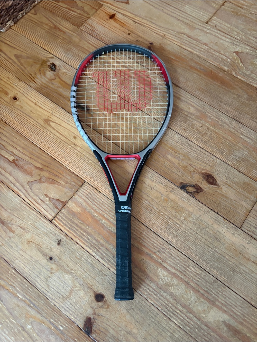 Wilson Tennis Racket in Black, Red & Silver Accents